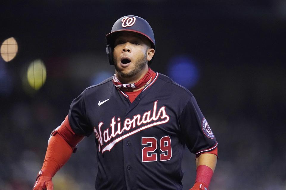 Washington Nationals' Yadiel Hernandez shouts as he arrives at home plate after hitting a home run against the Arizona Diamondbacks during the eighth inning of a baseball game Sunday, May 16, 2021, in Phoenix. (AP Photo/Ross D. Franklin)
