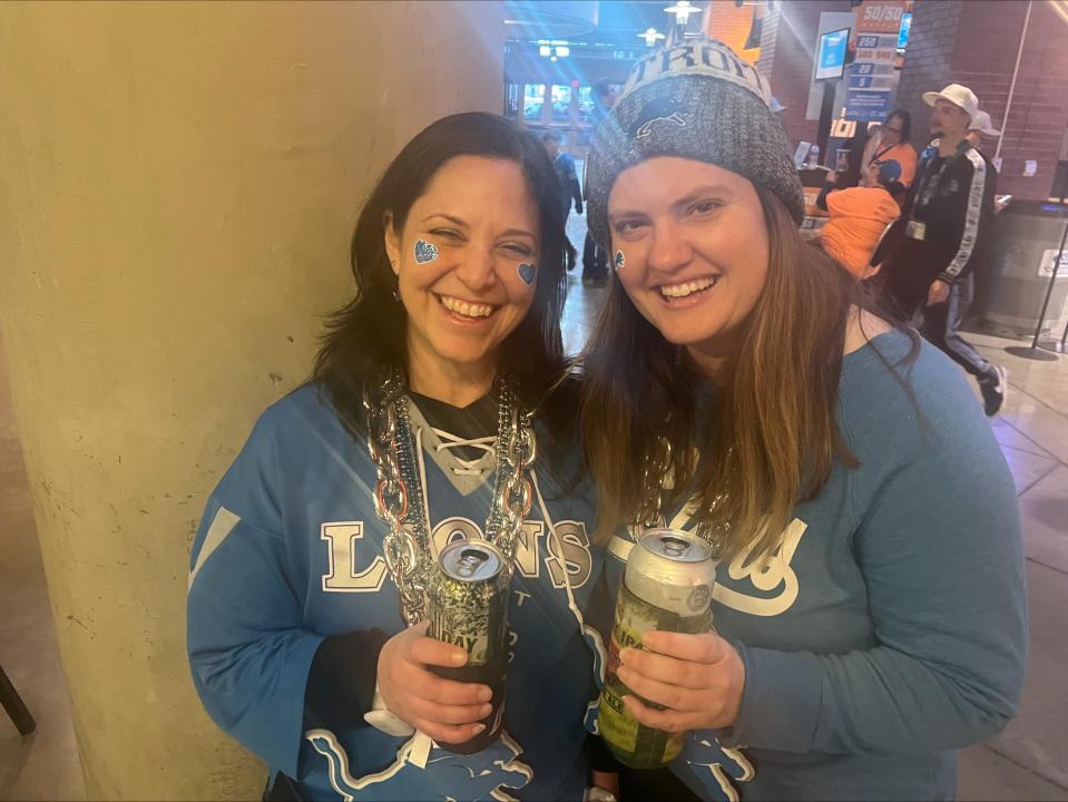 Laura Borruiker, 47, of Redford, and Sam Nowrocki, 35, of Detroit, enjoy a beer as they wait on the Ford Field concourse at halftime of the game between the Detroit Lions and Tampa Bay Buccaneers.