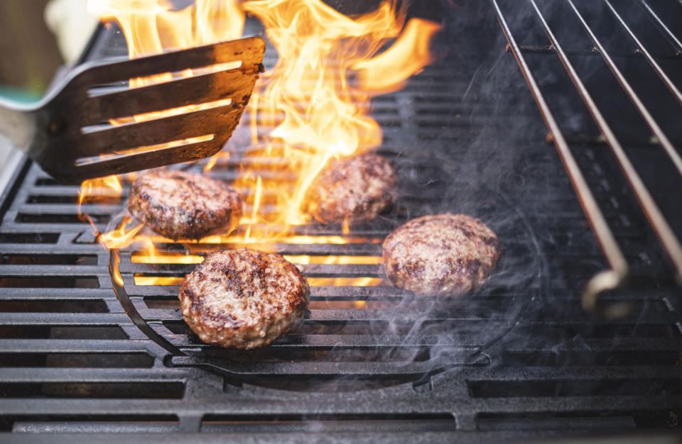 Burgers cooking on a grill