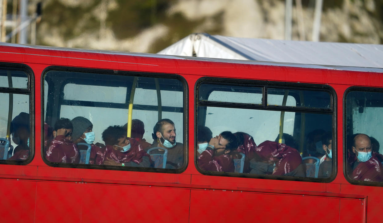 A group of people thought to be migrants wait on a holding bus after being brought in to Dover, Kent, following a small boat incident in the Channel after 27 people died yesterday in the worst-recorded migrant tragedy in the Channel. Picture date: Thursday November 25, 2021.