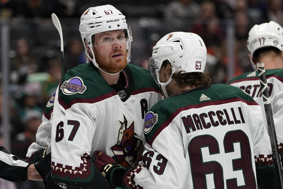 Arizona Coyotes left wing Lawson Crouse, left, celebrates his goal against the Anaheim Ducks with left wing Matias Maccelli during the second period of an NHL hockey game Wednesday, Nov. 1, 2023, in Anaheim, Calif. (AP Photo/Ryan Sun)