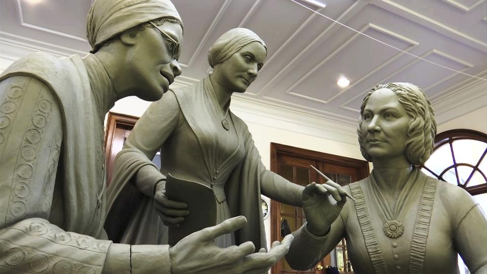 This Nov. 4, 2019, still image from video shows a portion of the first women's statue that will be installed in New York's Central Park, as it is being created by sculptor Meredith Bergmann in her studio in Ridgefield, Conn. The monument is scheduled to be dedicated Aug. 26, 2020, marking the 100th anniversary of American women winning the right to vote. (AP Photo/Joseph Frederick)