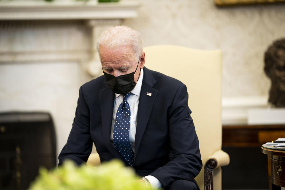 President Biden pauses during a meeting in the Oval Office Tuesday. (Photo by Doug Mills-Pool/Getty Images)