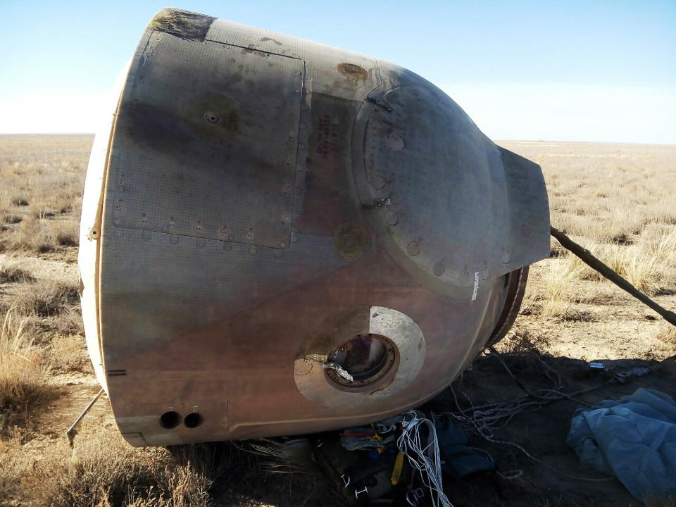 In this photo provided by Russian Defense Ministry Press Service, the Soyuz MS-10 space capsule lays in a field after an emergency landing near Dzhezkazgan, about 450 kilometers (280 miles) northeast of Baikonur, Kazakhstan, Thursday, Oct. 11, 2018. NASA astronaut Nick Hague and Roscosmos' Alexei Ovchinin lifted off as scheduled at 2:40 p.m. (0840 GMT; 4:40 a.m. EDT) Thursday from the Russian-leased Baikonur cosmodrome in Kazakhstan, but their Soyuz booster rocket failed about two minutes after the launch. (Russian Defense Ministry Press Service photo via AP)