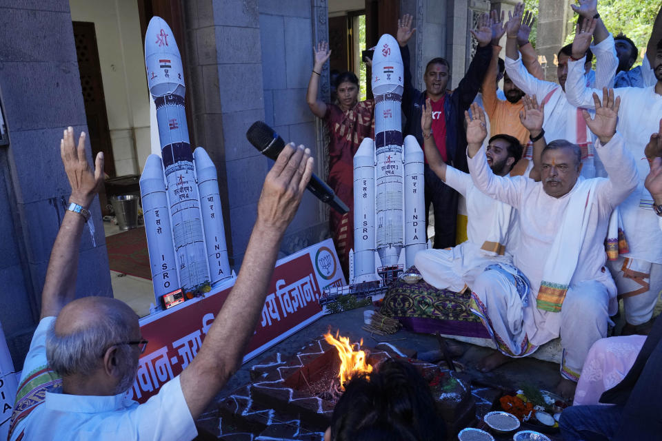 Members of India's Bharatiya Janata Party (BJP) perform Hindu rituals for the success of Indian spacecraft Chandrayaan-3, the word for "moon craft" in Sanskrit, inside a temple in Mumbai, India, Friday, July 14, 2023. The Indian spacecraft blazed its way to the far side of the moon Friday in a follow-up mission to its failed effort nearly four years ago to land a rover softly on the lunar surface, the country's space agency said. (AP Photo/Rajanish Kakade)