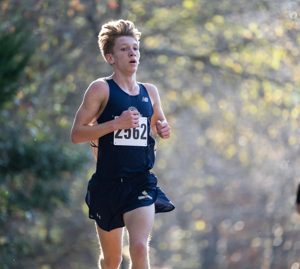 Delaware Military Academy’s Ethan Walther, who has transferred to Salesianum, runs to a win in the DIAA 2022 Cross Country Boys Division II Championship at Killens Pond State Park.