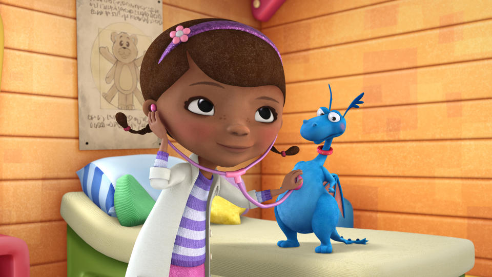 In this image released by Disney Junior, the character Doc McStuffins is shown with Stuff in a scene from Disney Junior's animated series "Doc McStuffins." The show, about a six-year-old girl who runs and operates a clinic for broken toys and worn out stuffed animals out of the playhouse in her backyard, will debut Friday, March 23, on the new 24-hour Disney Junior channel. (AP Photo/Disney Junior)