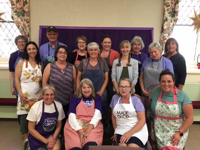 Meghanne Freivald, standing fourth from right, is pictured with students in the Naples Historical Society's grape pie making class in 2022.