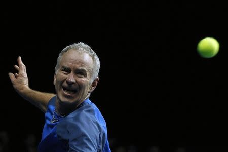 John McEnroe of the U.S returns a shot to compatriot Ivan Lendl during BNP Paribas Showdown tennis friendly match in Hong Kong March 4, 2013. REUTERS/Tyrone Siu