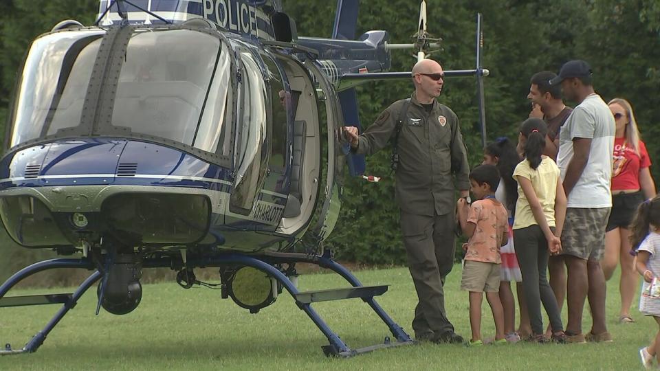 The community speaks with CMPD Aviation Unit pilot Sgt. Craig Varnum Tuesday night in Charlotte as part of National Night Out