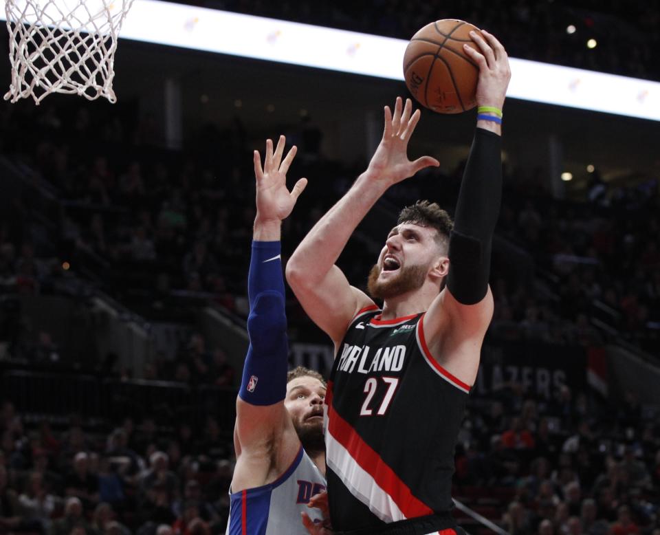 FILE - In this March 23, 2019, file photo, Portland Trail Blazers center Jusuf Nurkic, right, shoots as Detroit Pistons forward Blake Griffin defends during the second half of an NBA basketball game in Portland, Ore. Jusuf Nurkic is back and healthy. So are Zach Collins, Meyers Leonard, Giannis Antetokounmpo, Anthony Davis and plenty of others. If the four-month NBA shutdown had a silver lining, it’s that a lot of ailing players got well. (AP Photo/Steve Dipaola, File)