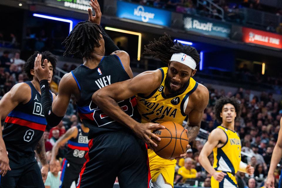Apr 7, 2023; Indianapolis, Indiana, USA; Indiana Pacers forward Isaiah Jackson (22) shoots the ball while  Detroit Pistons guard Jaden Ivey (23) defends in the first half at Gainbridge Fieldhouse. Mandatory Credit: Trevor Ruszkowski-USA TODAY Sports
