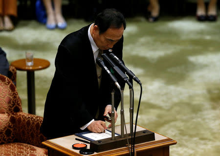 Yasunori Kagoike, head of Moritomo Gakuen, put his seal on a testimony during a parliamentary session in Tokyo, Japan March 23, 2017. REUTERS/Issei Kato