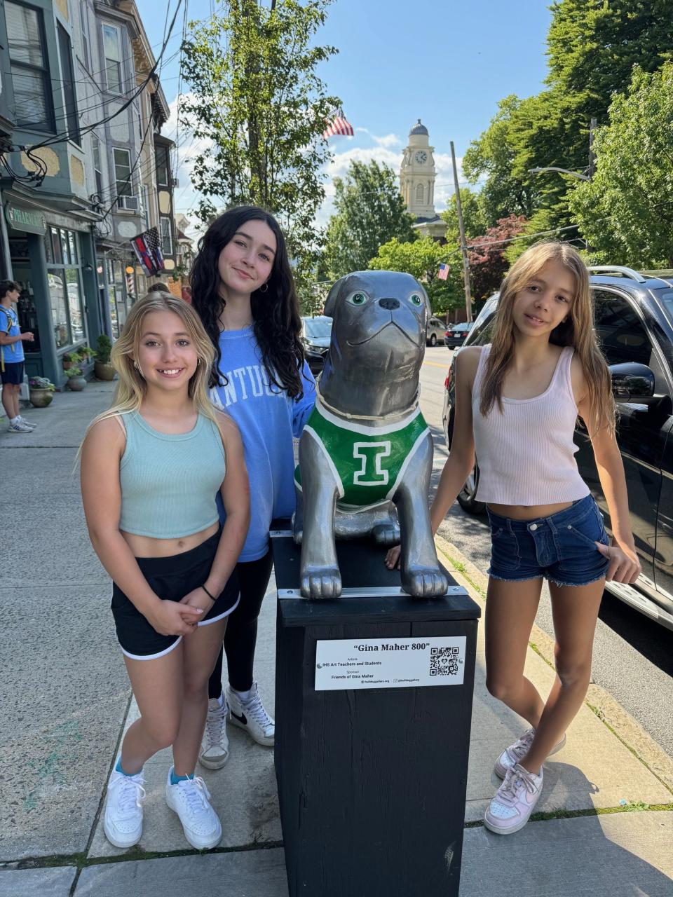 "Gina Maher 800" -- the creation of Irvington High School art teachers and students and sponsored by friends of Gina Maher -- celebrates the Irvington girls' basketball coach's 800th victory. It is one of the 27 bulldog statues that make up the 2024 Bulldog Walking Gallery on Main and Bridge streets in Irvington this summer. The statues, painted by local artists, depict connections to Irvington and will be auctioned off in the fall to raise funds to beautify the village. Last year's inaugural gallery raised nearly $17,000.