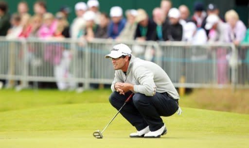 Australia's Adam Scott lines up a putt during his second round on day two of the British Open at Royal Lytham and St Annes in England. Scott stood second on eight-under through 13 holes