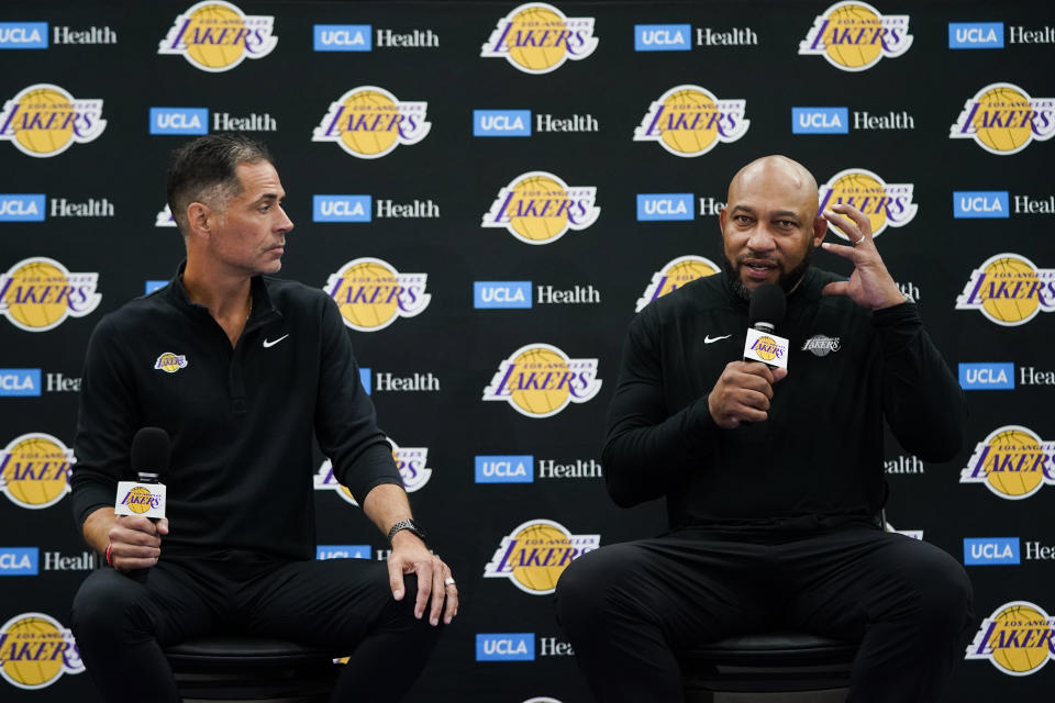 Los Angeles Lakers head coach Darvin Ham, right, speaks as he is joined by general manager Rob Pelinka during a news conference at the NBA basketball team's Media Day, Monday, Sept. 26, 2022, in El Segundo, Calif. (AP Photo/Jae C. Hong)