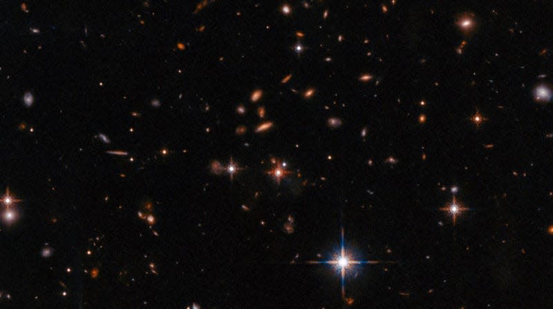 A Hubble Wide Field image of distant galaxies, one of which is the relevant quasar.