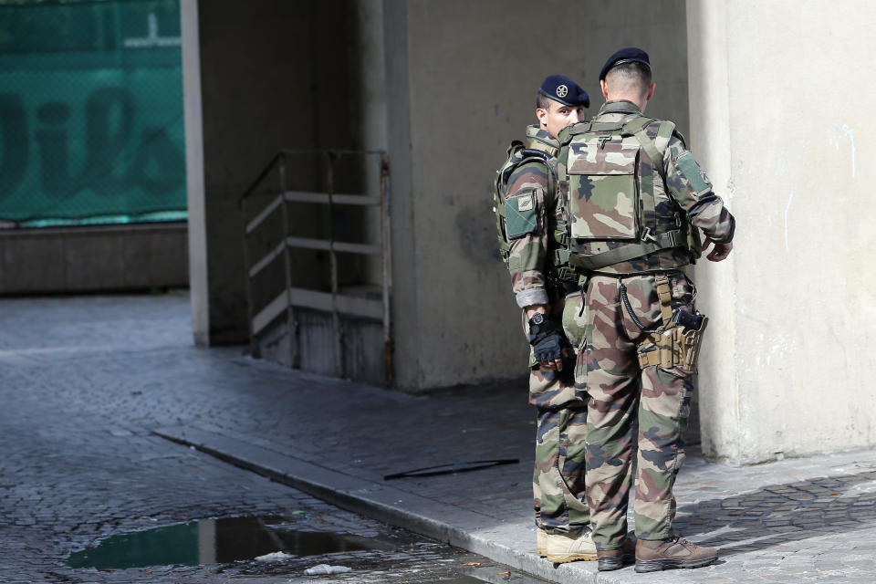 <p>French soldiers stand near the scene where French soldiers were hit and injured by a vehicle in the western Paris suburb of Levallois-Perret near Paris, France, Wednesday, Aug. 9, 2017. (Photo: Kamil Zihnioglu/AP) </p>