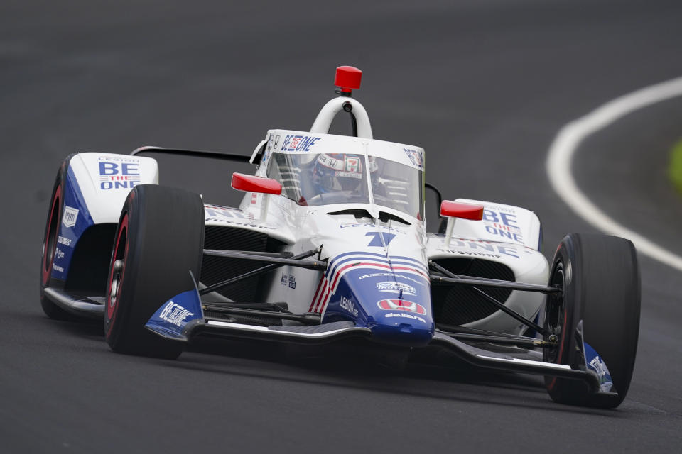 Tony Kanaan, of Brazil, drives through the first turn during qualifications for the Indianapolis 500 auto race at Indianapolis Motor Speedway in Indianapolis, Saturday, May 21, 2022. (AP Photo/Michael Conroy)