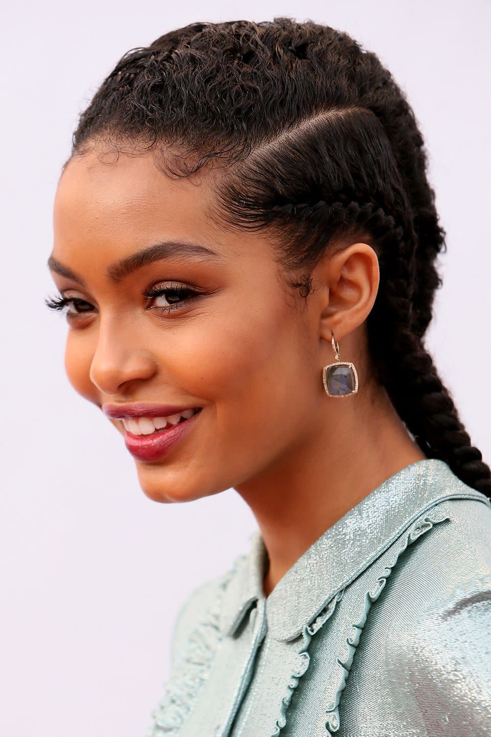 <p>Taylor says that if you're doing cornrows on natural hair, don't forget to detangle the hair as you braid. Once you've passed the scalp, you can continue to braid as normal and curl the ends around your finger to prevent them from unraveling (or use snap-free rubber bands or barrettes if you need). </p>