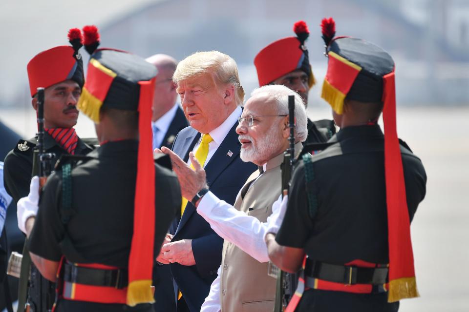 India's Prime Minister Narendra Modi (2R) greets US President Donald Trump upon his arrival at Sardar Vallabhbhai Patel International Airport in Ahmedabad on February 24, 2020. (Photo by MANDEL NGAN / AFP) (Photo by MANDEL NGAN/AFP via Getty Images)