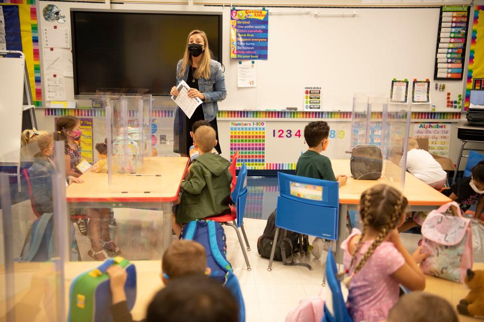 Kindergarten teacher Carly Soojian greets her classroom on their first day of school. Wayne school district is the last school system in Passaic County to have full-day kindergarten. Students arrive for their first day of school at James Fallon School in Wayne, N.J. on Thursday Sept. 9, 2021. 