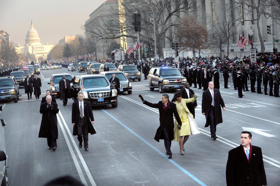 President Barack Obama and first lady Michelle Obama wave to the crowd during the inaugural parade on Jan. 20, 2009.