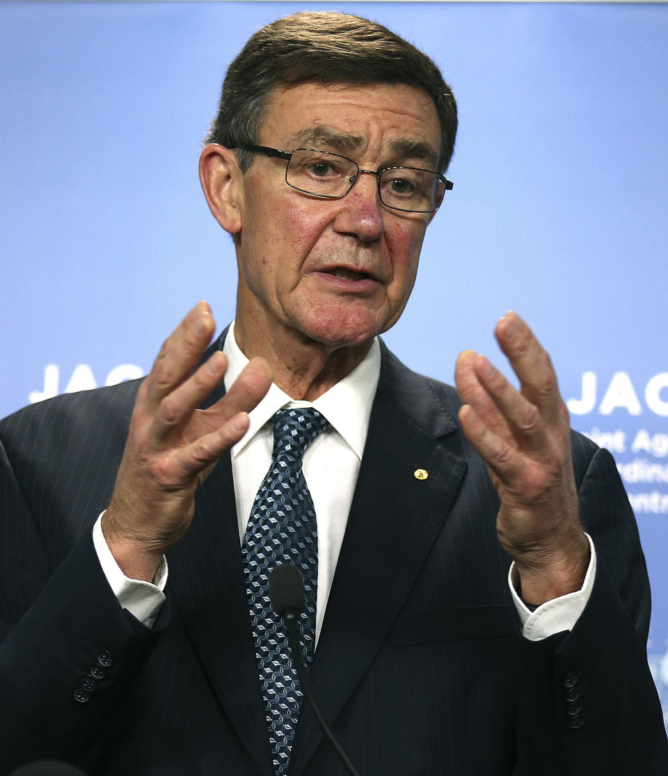 The chief coordinator of the Joint Agency Coordination Center retired Chief Air Marshal Angus Houston gestures as he speaks at a press conference about the ongoing search operations for missing Malaysia Airlines Flight 370 in Perth, Australia, Monday, April 14, 2014. Houston said search crews will send a robotic submarine deep into the Indian Ocean on Monday for the first time to try to determine whether underwater signals detected by sound-locating equipment are from the missing Malaysian plane's black boxes. (AP Photo/Rob Griffith)