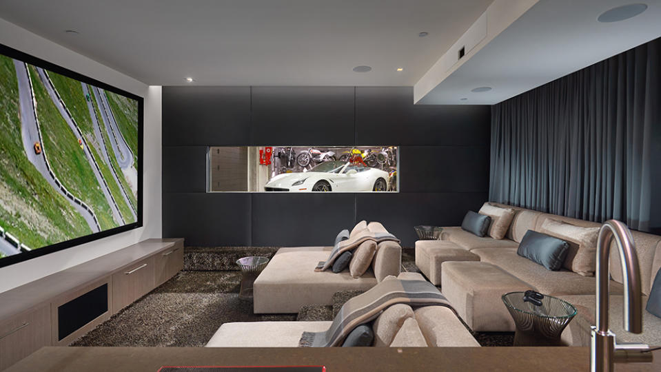 The screening room with a view of the garage. - Credit: Photo: Courtesy of Leigh Ann Rowe and Toby Ponnay/Sotheby’s International Realty