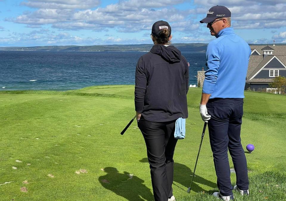 Harbor Point Golf Club professional Shaun Bezilla (right) stands on a green during the annual Harbor Cup with his daughter and caddie for the event, Madi Bezilla, at Bay Harbor Golf Club. Bezilla is currently the longest tenured member playing in the annual event.