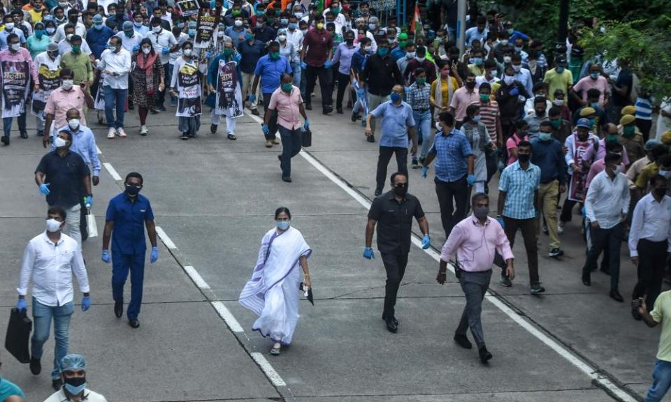 Mamata Banerjee, centre, leads a protest against the gang-rape and murder of a woman in Uttar Pradesh state and against the BJP-led government.