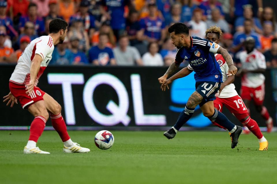 FC Cincinnati midfielder Luciano Acosta (10) passes in the first half of the MLS match between the FC Cincinnati and the New England Revolution at TQL Stadium in Cincinnati on Saturday, July 1, 2023. 