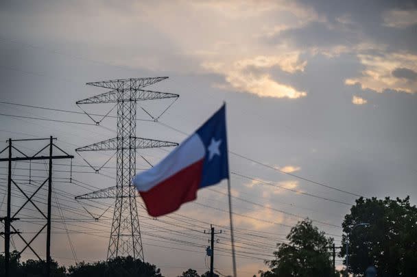 PHOTO: A transmission tower is seen on July 11, 2022, in Houston. ERCOT is urging Texans to voluntarily conserve power today, due to extreme heat potentially causing rolling blackouts. ERCOT has also projected there to be no blackouts this week. (Brandon Bell/Getty Images, FILE)