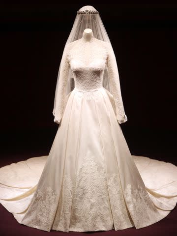 <p>Lewis Whyld/WPA Pool/ Getty </p> A detail of the Duchess of Cambridge's wedding dress, designed by Sarah Burton for Alexander McQueen, is photographed before it goes on display at Buckingham Palace during the annual summer opening on July 20, 2011 in London, England.