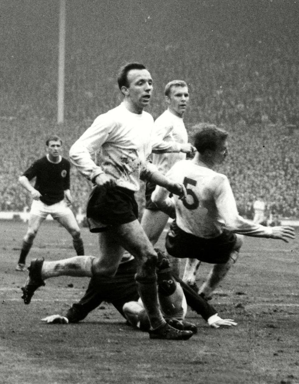 Nobby Stiles with Jack Charlton and Bobby Moore in the England v Scotland match at Wembley, April 1965 -  Colorsport/Shutterstock