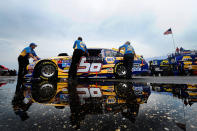 TALLADEGA, AL - MAY 06: Crew members push the #56 NAPA Auto Parts Toyota through the garage area prior to the NASCAR Sprint Cup Series Aaron's 499 at Talladega Superspeedway on May 6, 2012 in Talladega, Alabama. (Photo by Jared C. Tilton/Getty Images)