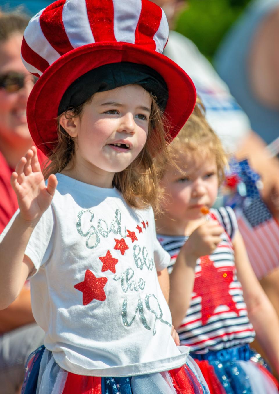 From left, Autumn Wray, 6, and May Wray, 3, watch the Southampton Days Independence Day Parade Monday, July 5, 2021 at Second Street Pike. Hundreds gathered for the Independence Day celebration, which was canceled last year due to the COVID-19 pandemic.