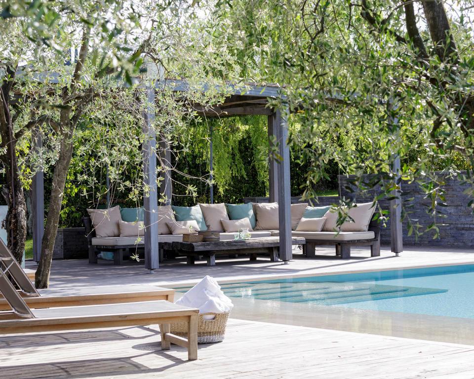 Position a pergola and lounge by the pool