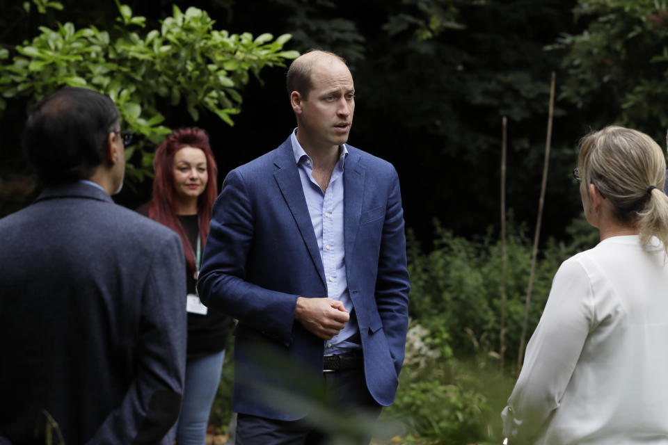 EMBARGOED TO 2200 SATURDAY JULY 18 The Duke of Cambridge speaks with Fay Hirel, Head of Care and Support for the Longhurst Group (right) and Ali Manji, Service Manager for Cross Keys Homes (left) during a visit to the Garden House part of the Peterborough Light Project, a charity which offers advice and support to rough sleepers.