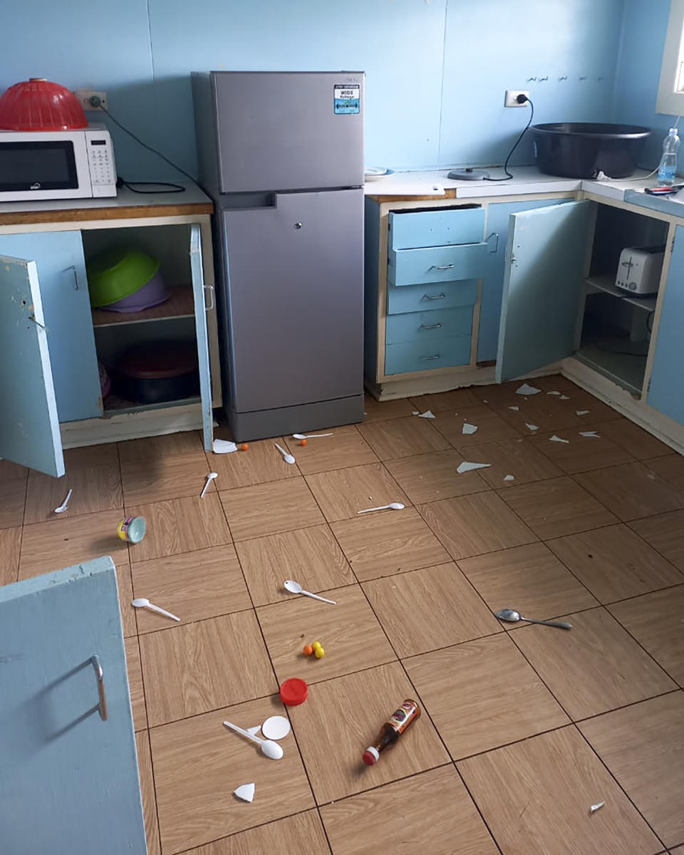 Debris lies strewn across the floor in the kitchen of Renagi Ravu's house in Kainantu, following a 7.6 magnitude earthquake in northeastern Papua New Guinea, Sunday Sept. 11, 2022. The quake hit at 9:46 a.m. local time, with the epicenter 67 kilometers (42 miles) east of Kainantu, a sparsely populated area. (Renagi Ravu via AP)