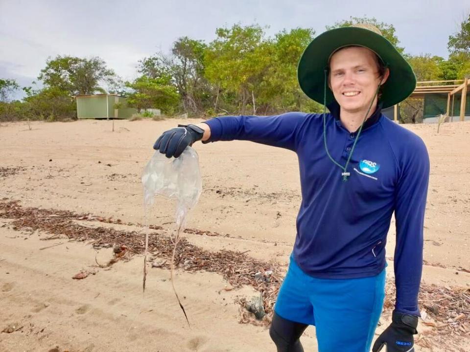 Scott Morrissey holds a large jellyfish