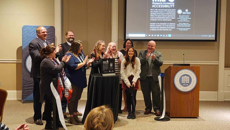 Mia Warren (center) cuts the ribbon on her new MIA System (Museums Increasing Accessibility) at the Museum of East Tennessee History on Jan. 3, 2024.