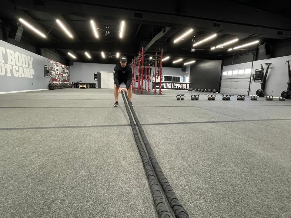 CJ Wehrkamp sets up for HIIT training at his central Sioux Falls Fit Body Boot Camp location. He has special permission to add a second location about four miles, instead of a franchise-standard six, from this one. March 15, 2022.