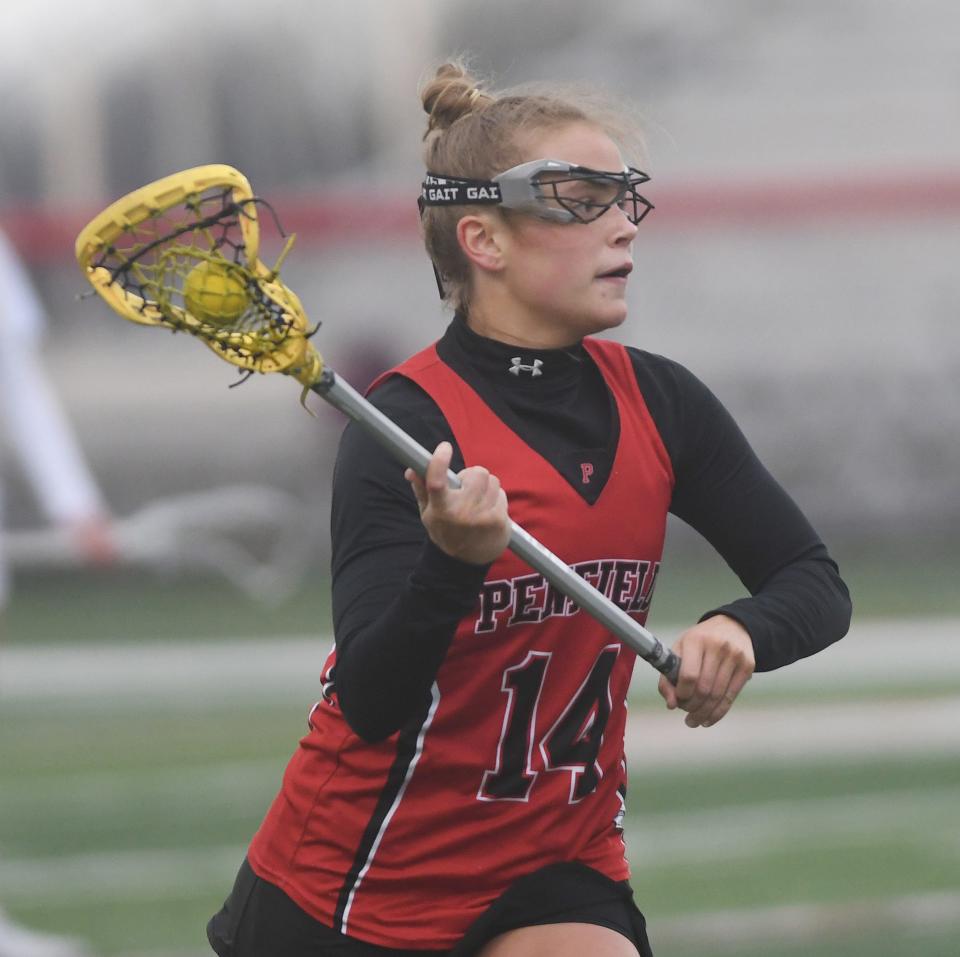 Penfield's Grace Rund looks to make a pass.