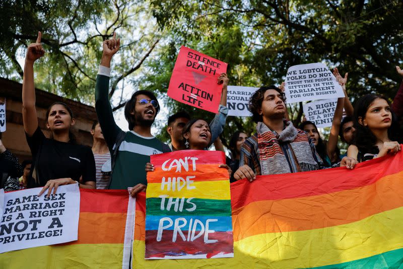 Students and supporters of Students' Federation of India (SFI) take part in an LGBT+ Pride vigil at North Campus in New Delhi