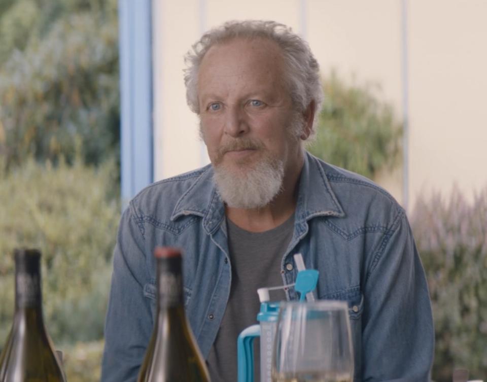 Daniel Stern as Bill eats a meal with family and friends in "Shrill"