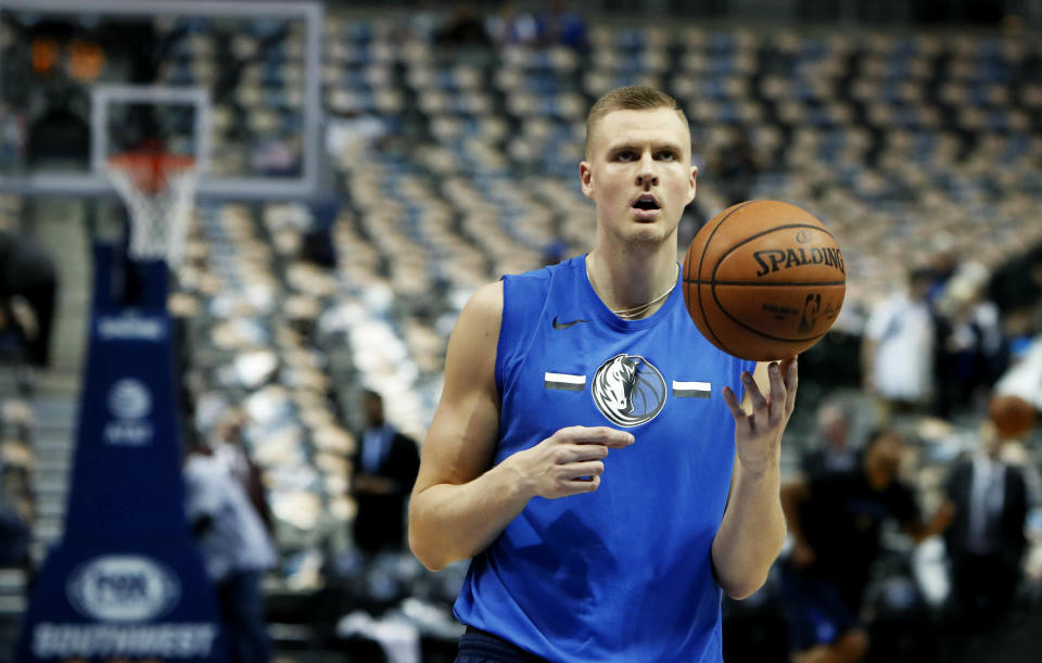 FILE - In this April 3, 2019, file photo, Dallas Mavericks forward Kristaps Porzingis practices before an NBA basketball game against the Minnesota Timberwolves in Dallas. Porzingis was involved in an altercation at a nightclub in his native Latvia. After video showed the 7-foot-3 forward with a bloody forehead, the Mavericks said Sunday, May 12, "It is our understanding that Kristaps was jumped and assaulted outside of a club," without providing further details. (AP Photo/LM Otero, File)