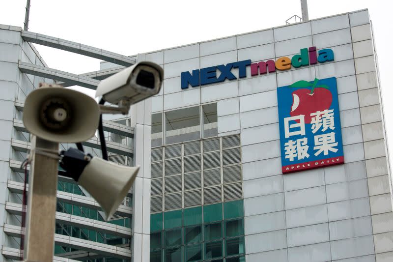 A security camera is seen in front of the headquarters of Apple Daily and Next Media in Hong Kong