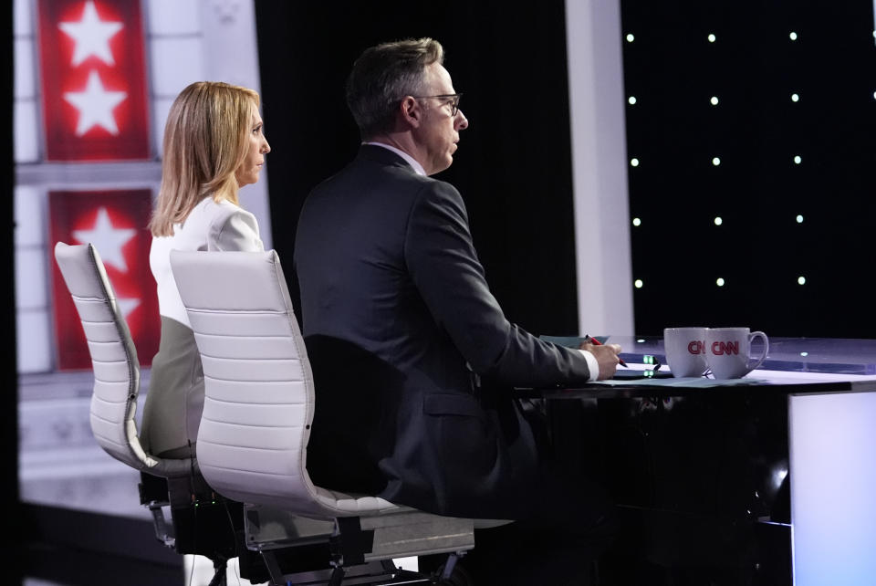 CNN's Dana Bash, left, and Jake Tapper listen as they moderate a presidential debate between President Joe Biden and Republican presidential candidate former President Donald Trump, Thursday, June 27, 2024, in Atlanta. (AP Photo/Gerald Herbert)