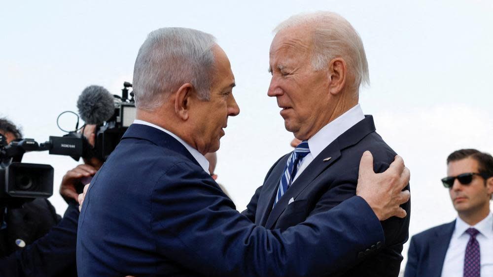 Netanyahu and Biden embrace during Biden's visit to Israel in October 2023